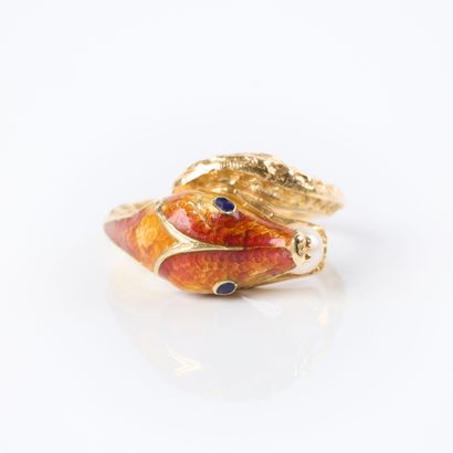 Yellow gold ring featuring a snake holding...
