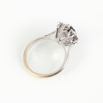 White gold ring set with an oval sapphire...