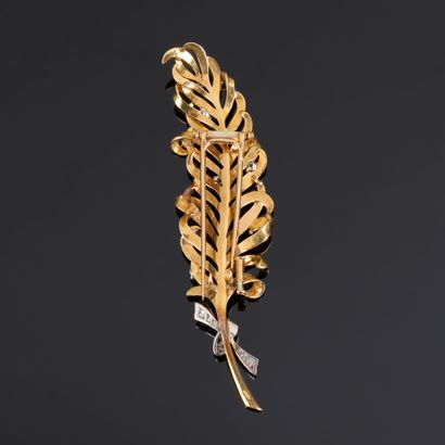 BOUCHERON. Two-tone gold feather brooch set...
