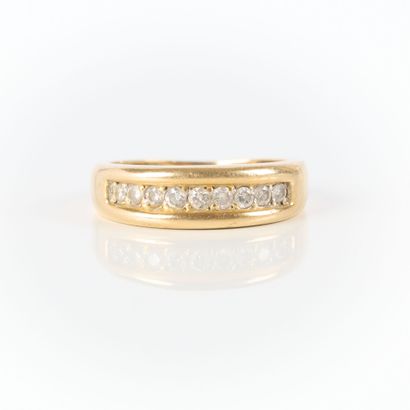 Gold wedding band set with a line of 9 diamonds....