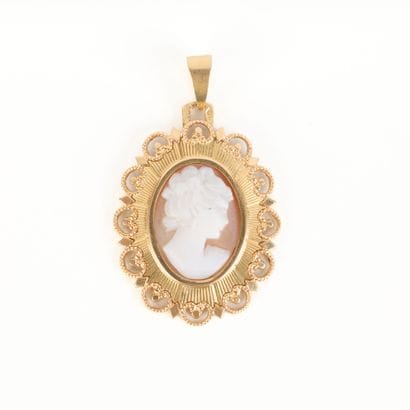 Gold pendant set with a shell cameo with...