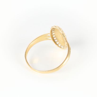 Gold marquise ring set with three half-pearls...