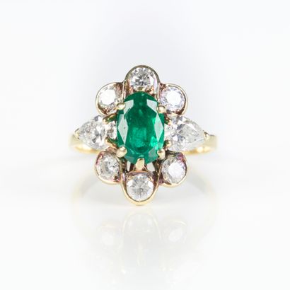 Yellow gold ring set with an oval emerald...