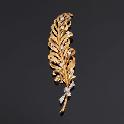 BOUCHERON. Two-tone gold feather brooch set...