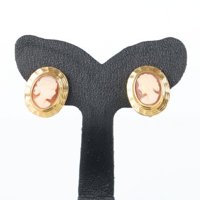 Pair of gold earrings each set with a shell...