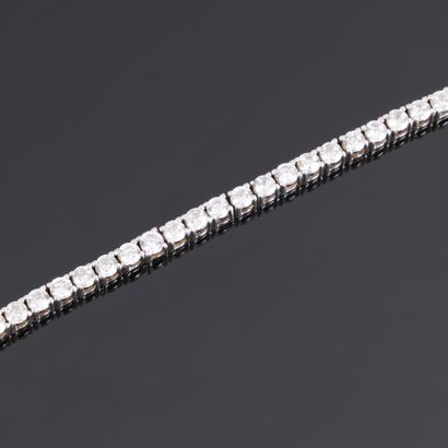 Line bracelet in silver set with white stones....