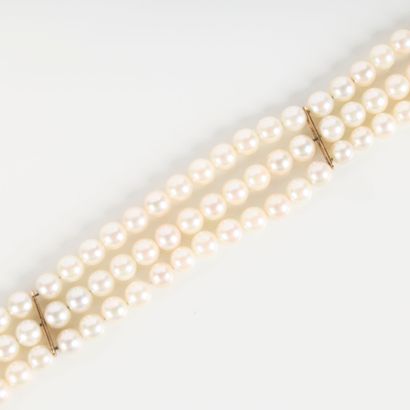 Bracelet with three strands of cultured pearls...
