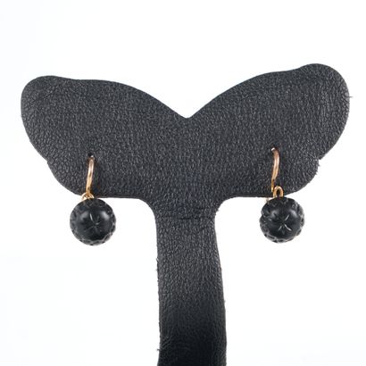 Pair of gold sleeper earrings set with black...