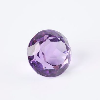 On paper, a round amethyst weighing approx....