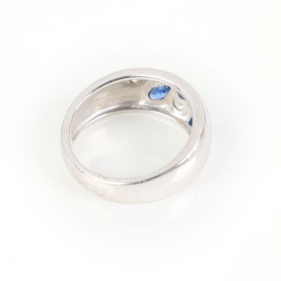 White gold ring set with three sapphires...