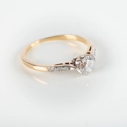 Fine two-tone gold solitaire ring set with...