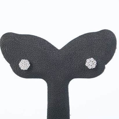 Earrings in platinum, each set with 7 round...