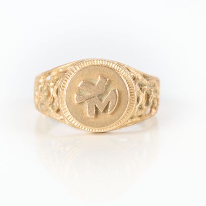 Openwork gold signet ring numbered YM. TDD...