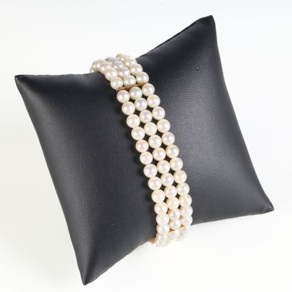 Bracelet with three strands of cultured pearls...
