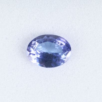 Oval-cut Tanzanite on paper with certificate:...
