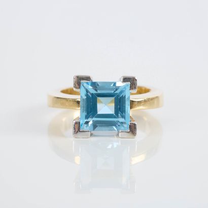 Two-tone gold ring set with a square topaz...