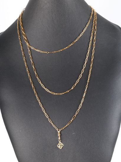 Large gold long necklace with charm. 180...