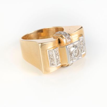 A striking tank-style ring in gold and platinum,...
