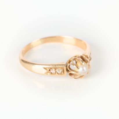 Pink gold ring set with a half-pearl and...