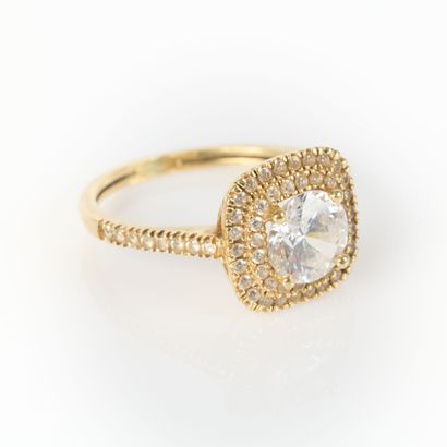 Yellow gold ring centered with a zircon in...