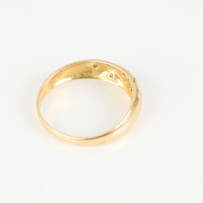 Gold band ring set with small white stones....