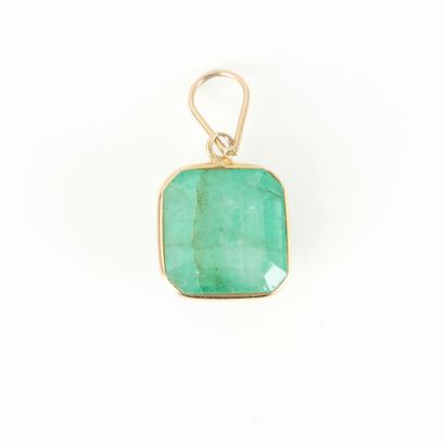 Gold pendant set with an emerald-cut emerald...