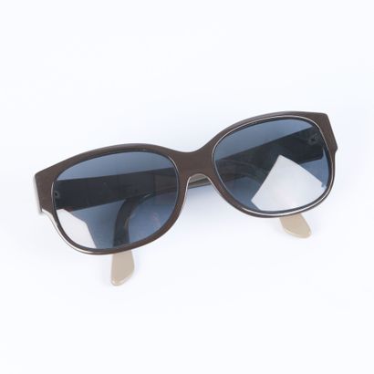 CARTIER. Pair of black and grey plastic sunglasses...