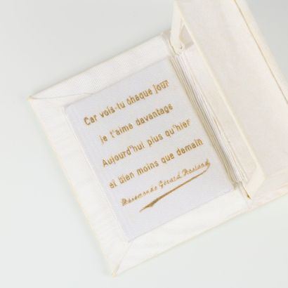 Gold love medal set with a diamond and small...