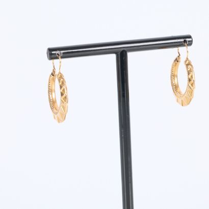 Pair of engraved gold hoop earrings. Diam....