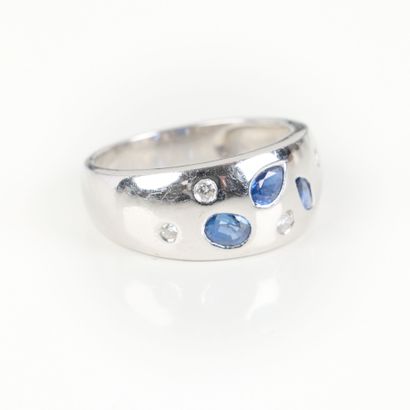 White gold ring set with three sapphires...