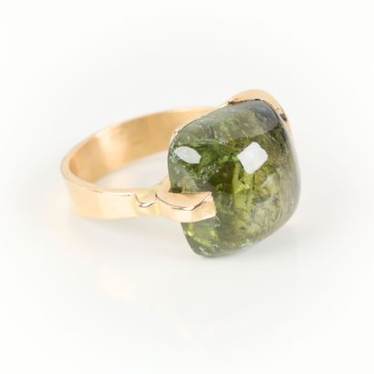 Contemporary gold ring set with a fine cabochon...