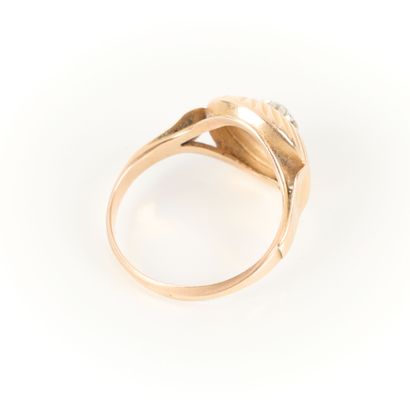 Two-tone gold ring set with a white stone....