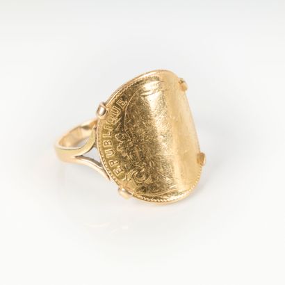 Gold ring set with a 10 FF rooster coin....