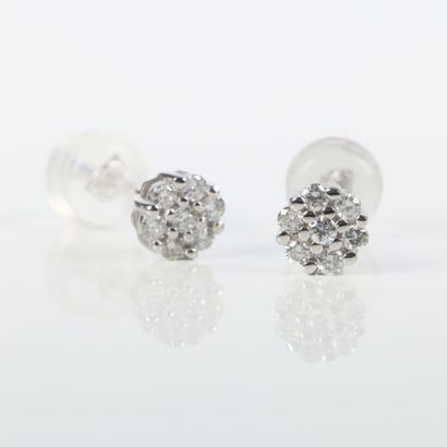 Earrings in platinum, each set with 7 round...