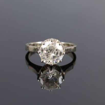 White gold solitaire ring set with a white...