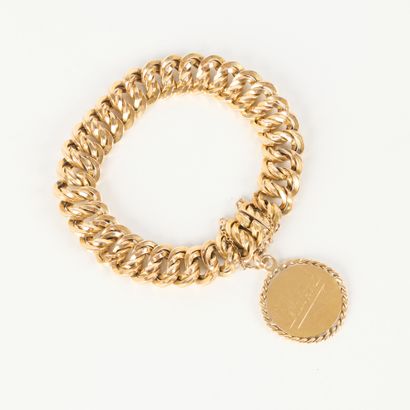 American-style gold curb chain, holding a...
