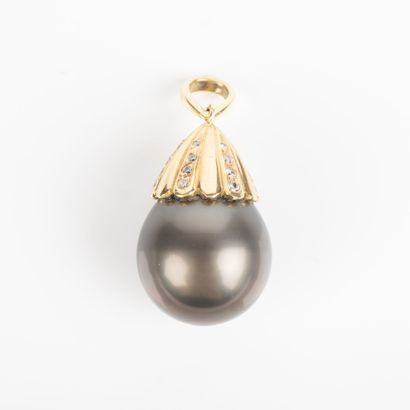 Gold pendant set with a large gray cultured...