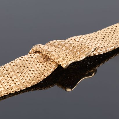 Large braided gold bracelet. Circa 1950-60....