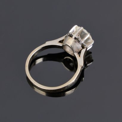 White gold solitaire ring set with a white...