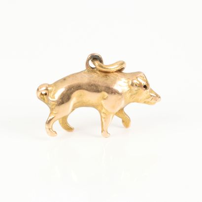 Small gold charm with pig design. Length...