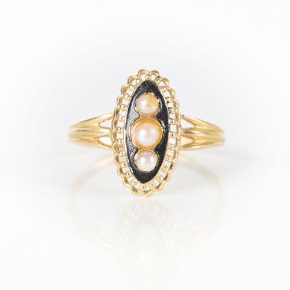 Gold marquise ring set with three half-pearls...
