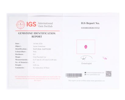 Oval-cut pink sapphire on paper with certificate...