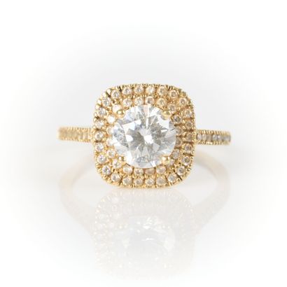 Yellow gold ring centered with a zircon in...