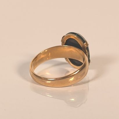 Rose gold ring set with an oval blood jasper...