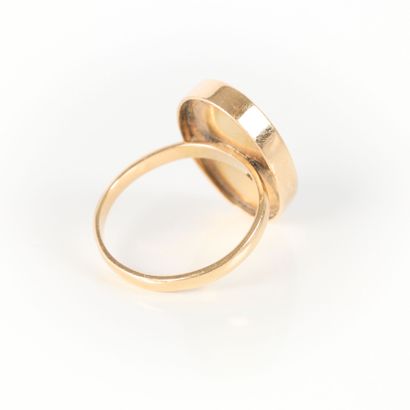 Gold ring set with a shell cameo engraved...