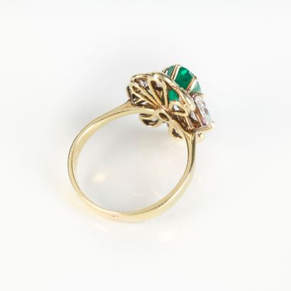 Yellow gold ring set with an oval emerald...
