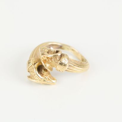 Gold ring featuring interlocking ram heads...