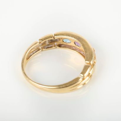 Gold band ring set with 4 oval gemstones....