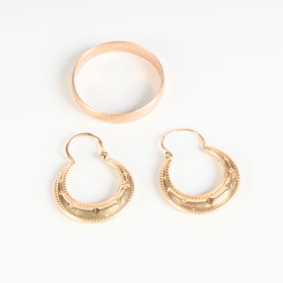 Flat wedding band and pair of gold hoop earrings....