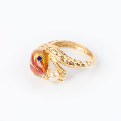 Yellow gold ring featuring a snake holding...